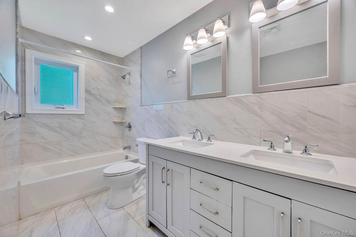 Bathroom, Dual Sink Vanities, Interior, Marble, Marble Walls, Recessed Lighting