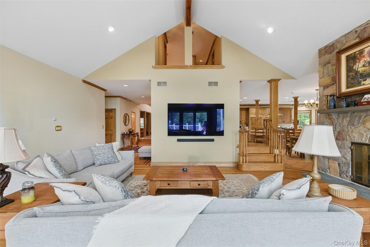 Fireplace, Interior, Living room, Recessed Lighting, Stone Walls, Wood Texture Flooring