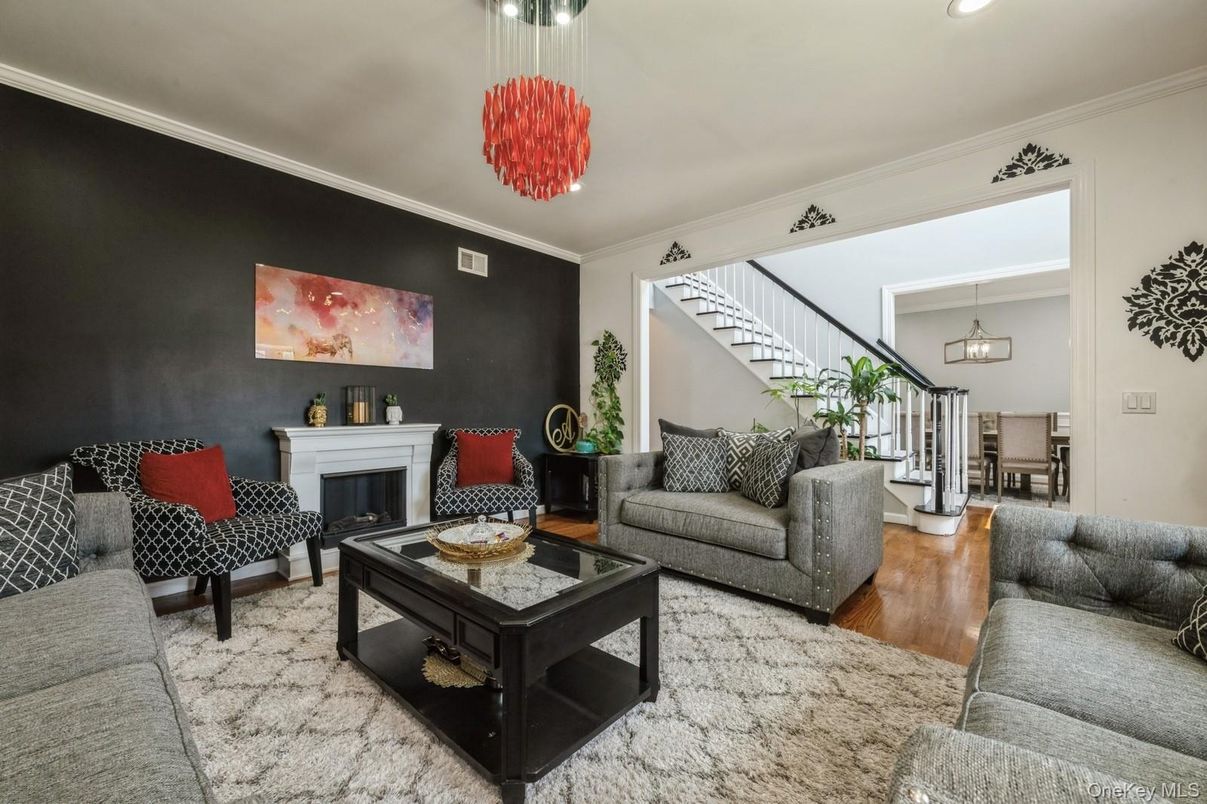 Chandelier, Dining room, Fireplace, Interior, Living room, Pendant Lights, Recessed Lighting, Wood Texture Flooring