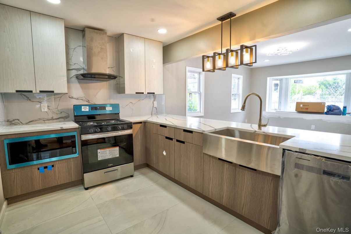 Interior, Kitchen, Marble Walls, Pendant Lights, Recessed Lighting, Stainless Steel Appliances