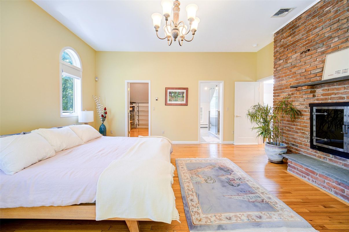 Bedroom, Chandelier, Fireplace, Interior, Stone Walls, Wood Texture Flooring
