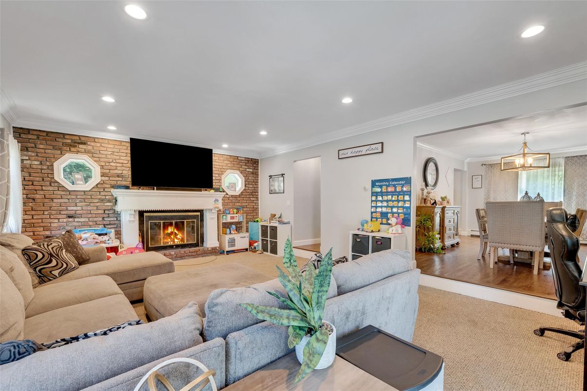 Dining room, Fireplace, Interior, Living room, Pendant Lights, Recessed Lighting, Stone Walls, Wood Texture Flooring