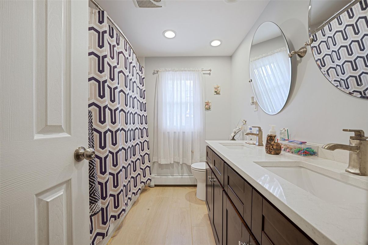 Bathroom, Dual Sink Vanities, Interior, Recessed Lighting, Wood Texture Flooring