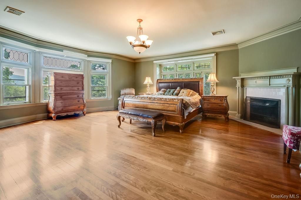 Bedroom, Chandelier, Fireplace, Interior, Wood Texture Flooring