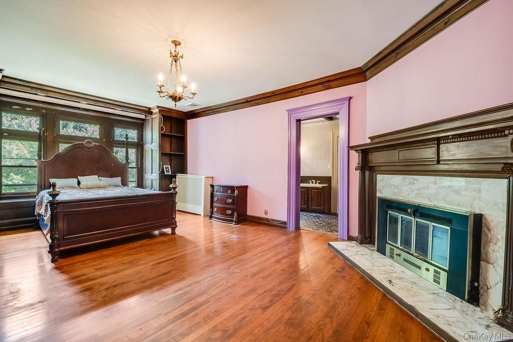 Bedroom, Chandelier, Fireplace, Interior, Wood Texture Flooring