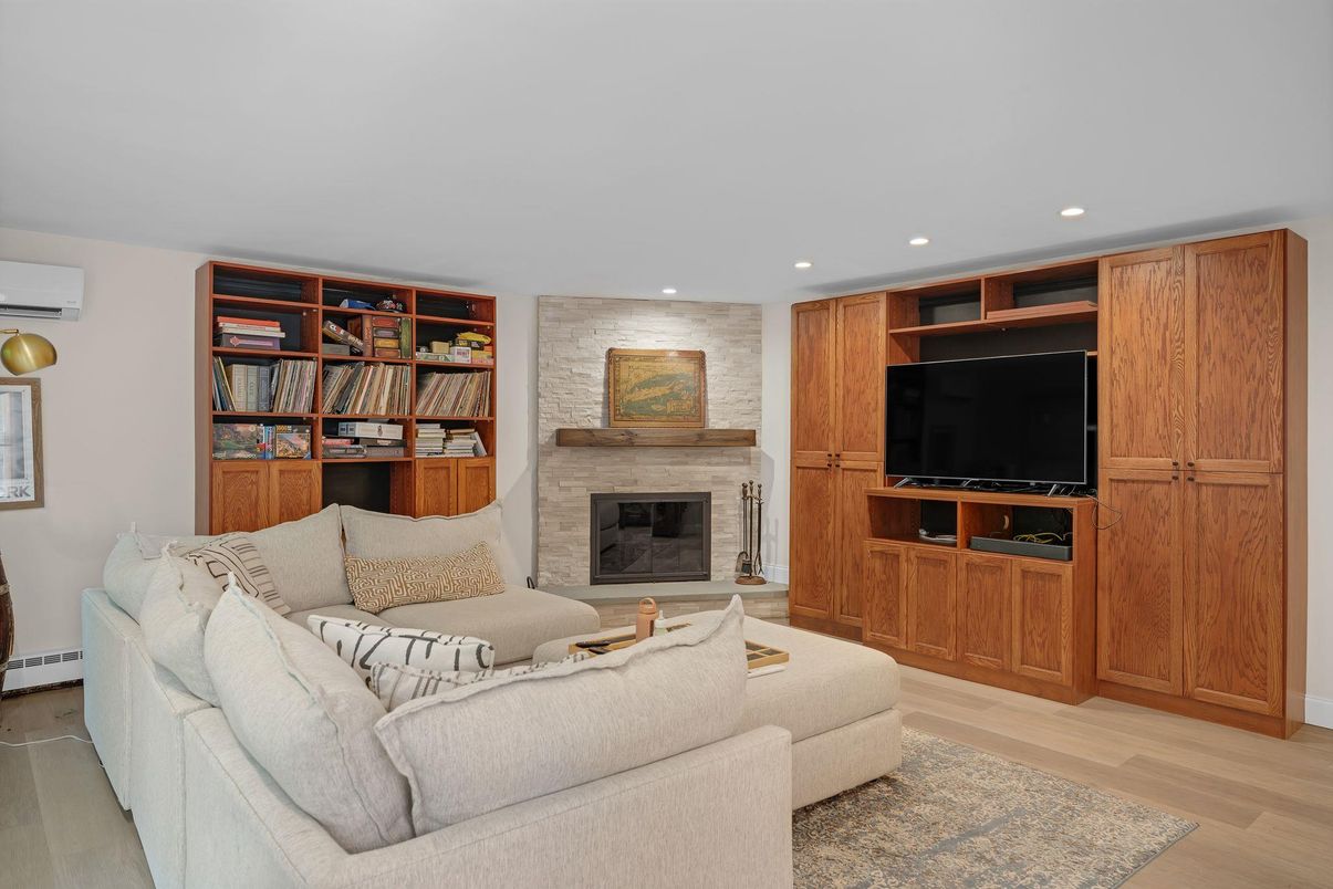 Fireplace, Interior, Living room, Recessed Lighting, Stone Walls, Wood Texture Flooring