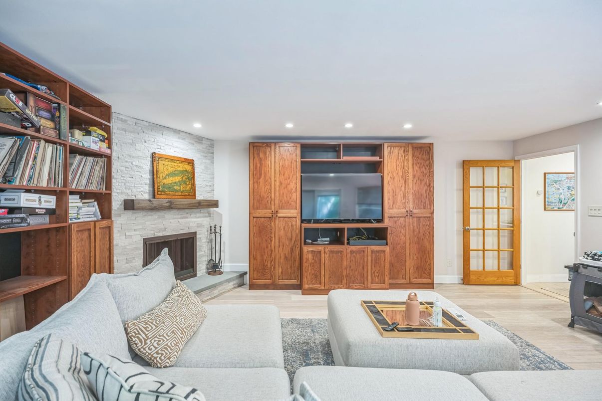 Fireplace, Interior, Living room, Recessed Lighting, Stone Walls, Wood Texture Flooring