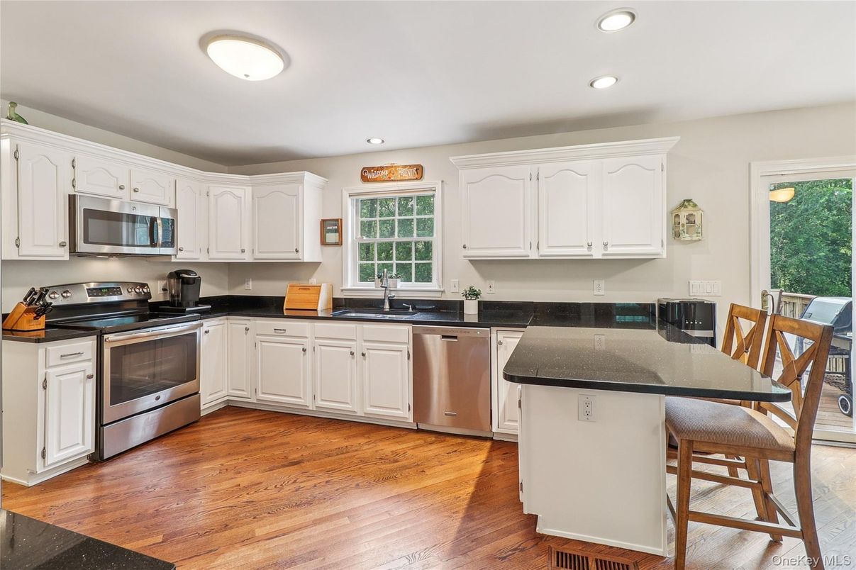 Dining room, Interior, Kitchen, Recessed Lighting, Stainless Steel Appliances, Wood Texture Flooring