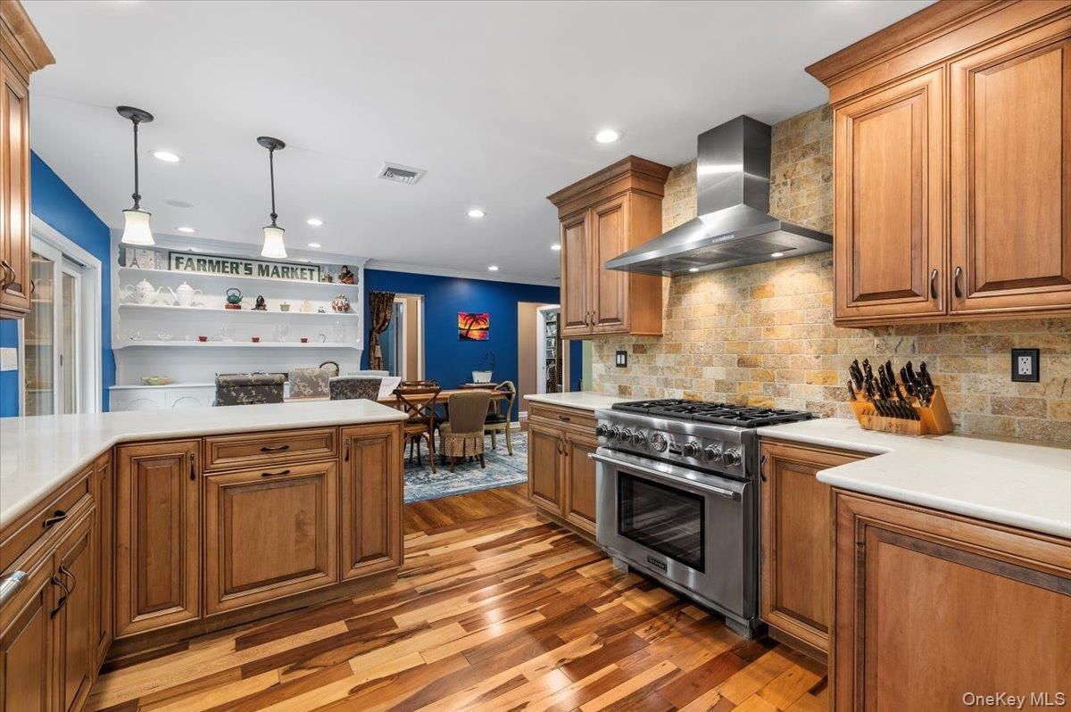 Dining room, Interior, Kitchen, Pendant Lights, Recessed Lighting, Stainless Steel Appliances, Stone Walls, Wood Texture Flooring