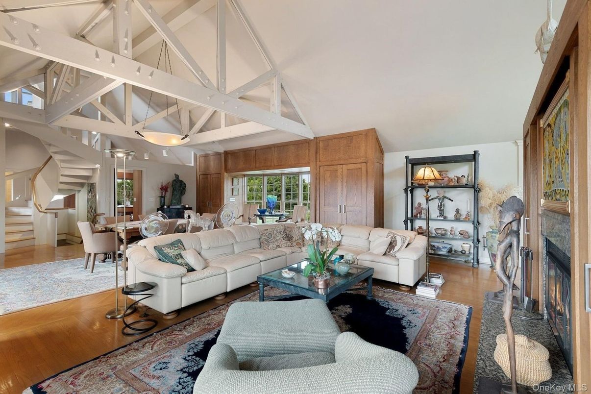 Dining room, Fireplace, Interior, Living room, Recessed Lighting, Wood Texture Flooring