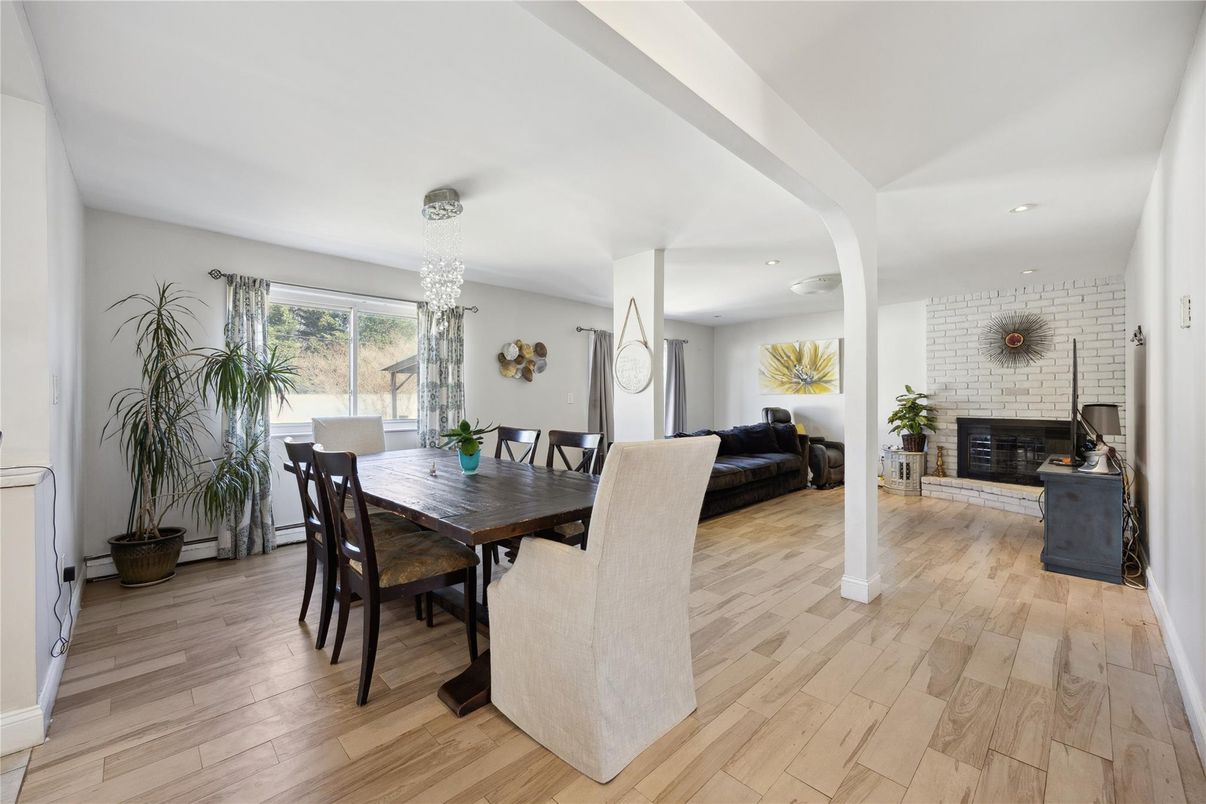 Dining room, Fireplace, Interior, Recessed Lighting, Stone Walls, Wood Texture Flooring