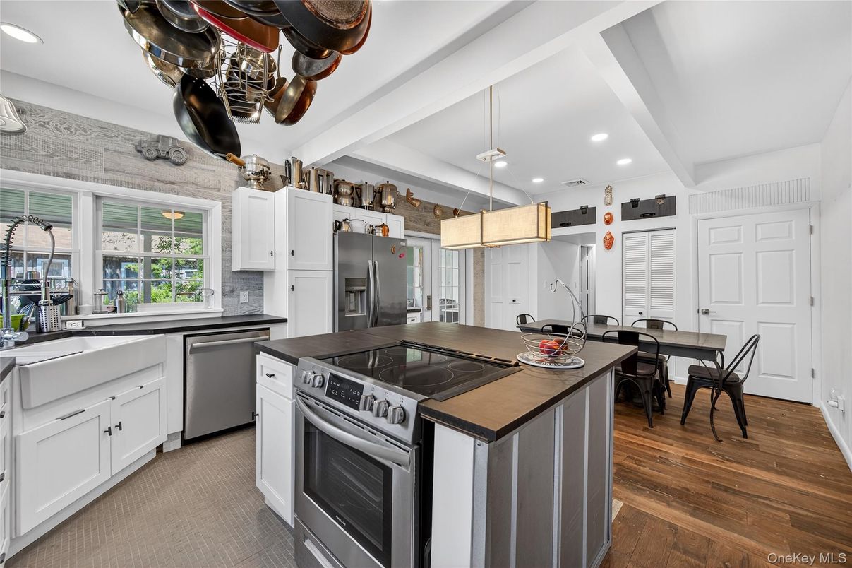 Dining room, Interior, Kitchen, Pendant Lights, Recessed Lighting, Stainless Steel Appliances, Wood Texture Flooring