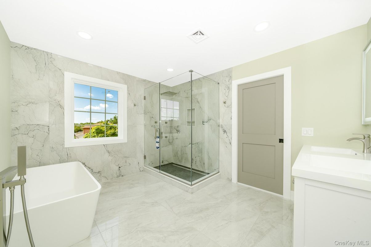 Bathroom, Free Standing Baths, Glass Shower, Interior, Marble, Marble Walls, Recessed Lighting