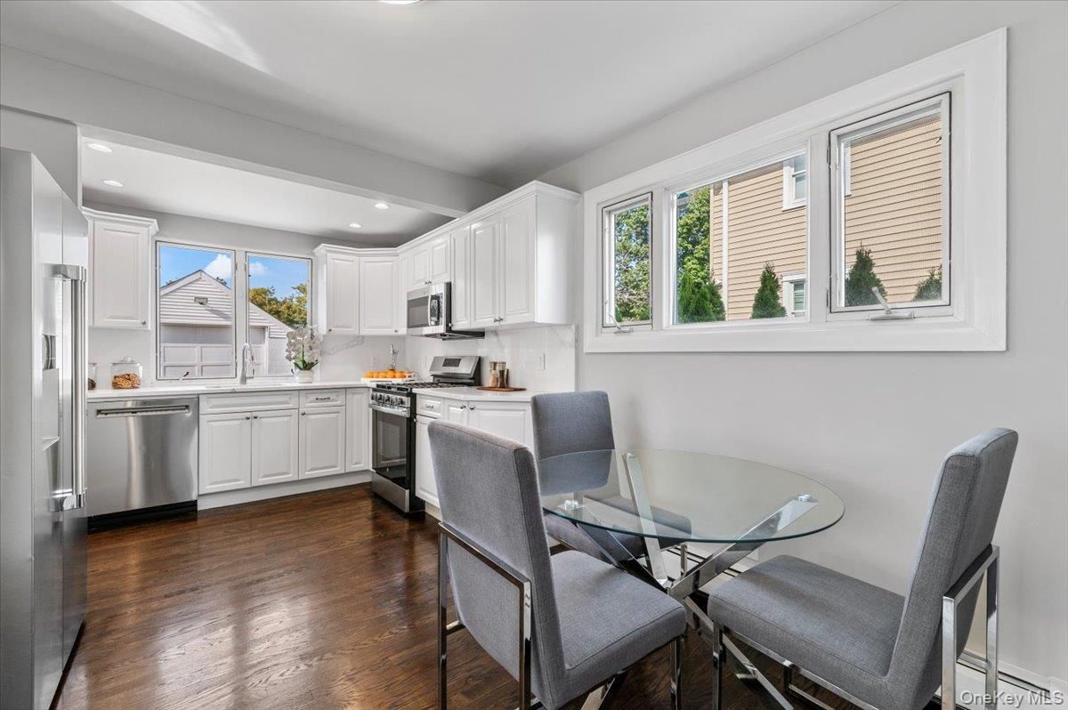Dining room, Interior, Kitchen, Recessed Lighting, Stainless Steel Appliances, Wood Texture Flooring