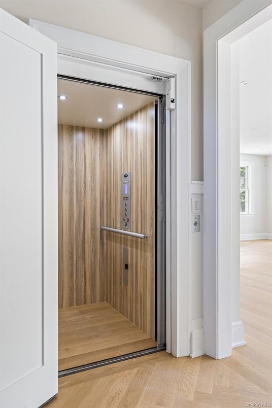 Elevator, Interior, Recessed Lighting, Wood Texture Flooring, Wooden Walls