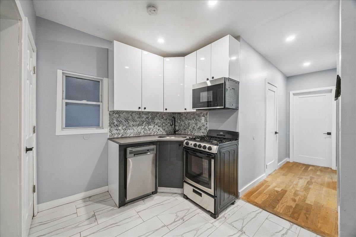 Interior, Kitchen, Marble, Recessed Lighting, Stainless Steel Appliances, Wood Texture Flooring