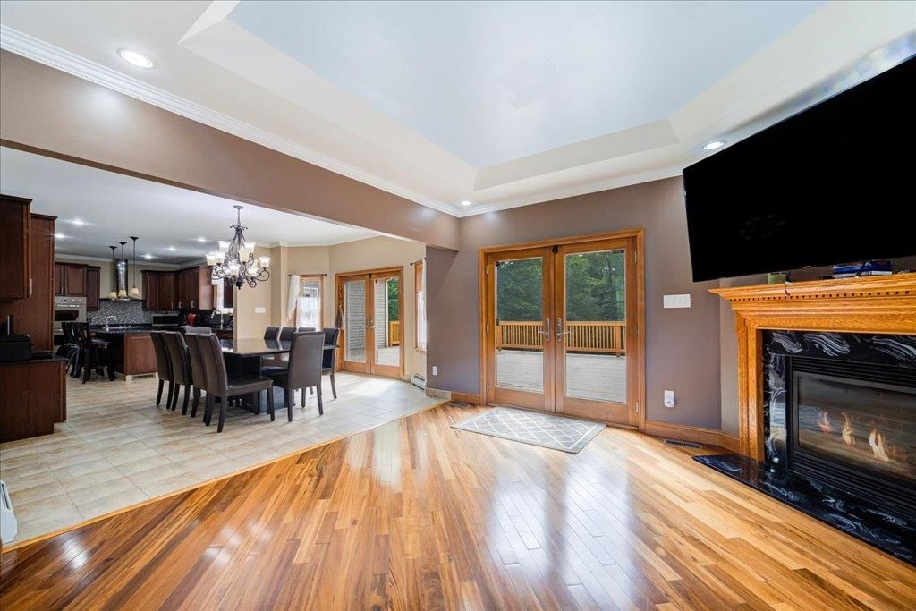 Chandelier, Dining room, Fireplace, Interior, Kitchen, Recessed Lighting, Wood Texture Flooring