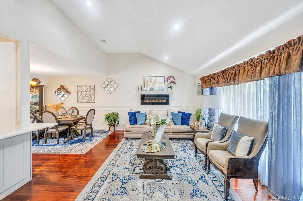 Dining room, Fireplace, Interior, Living room, Recessed Lighting, Wood Texture Flooring