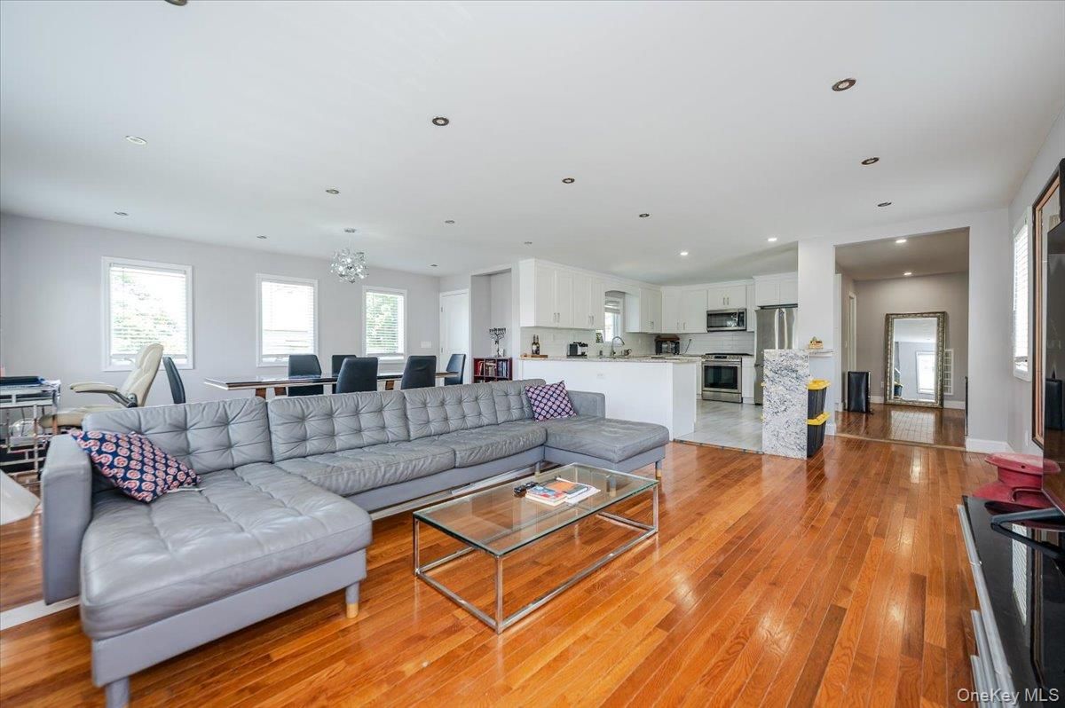 Chandelier, Dining room, Interior, Kitchen, Living room, Recessed Lighting, Stainless Steel Appliances, Wood Texture Flooring