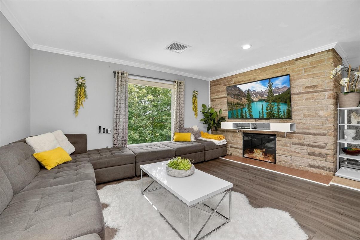 Fireplace, Interior, Living room, Recessed Lighting, Stone Walls, Wood Texture Flooring