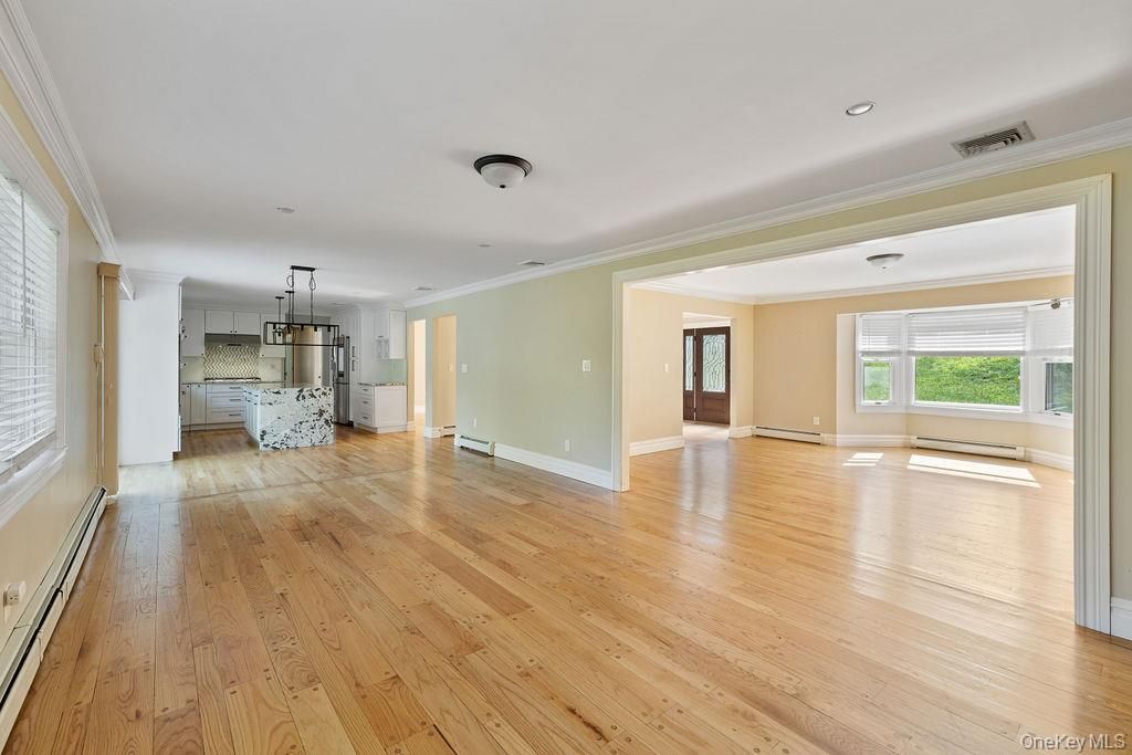 Empty room, Interior, Kitchen, Pendant Lights, Recessed Lighting, Stainless Steel Appliances, Wood Texture Flooring