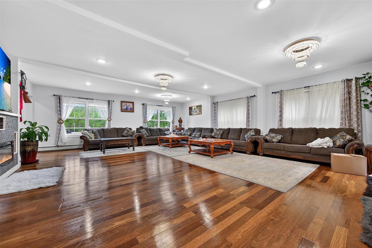 Chandelier, Fireplace, Interior, Living room, Recessed Lighting, Wood Texture Flooring