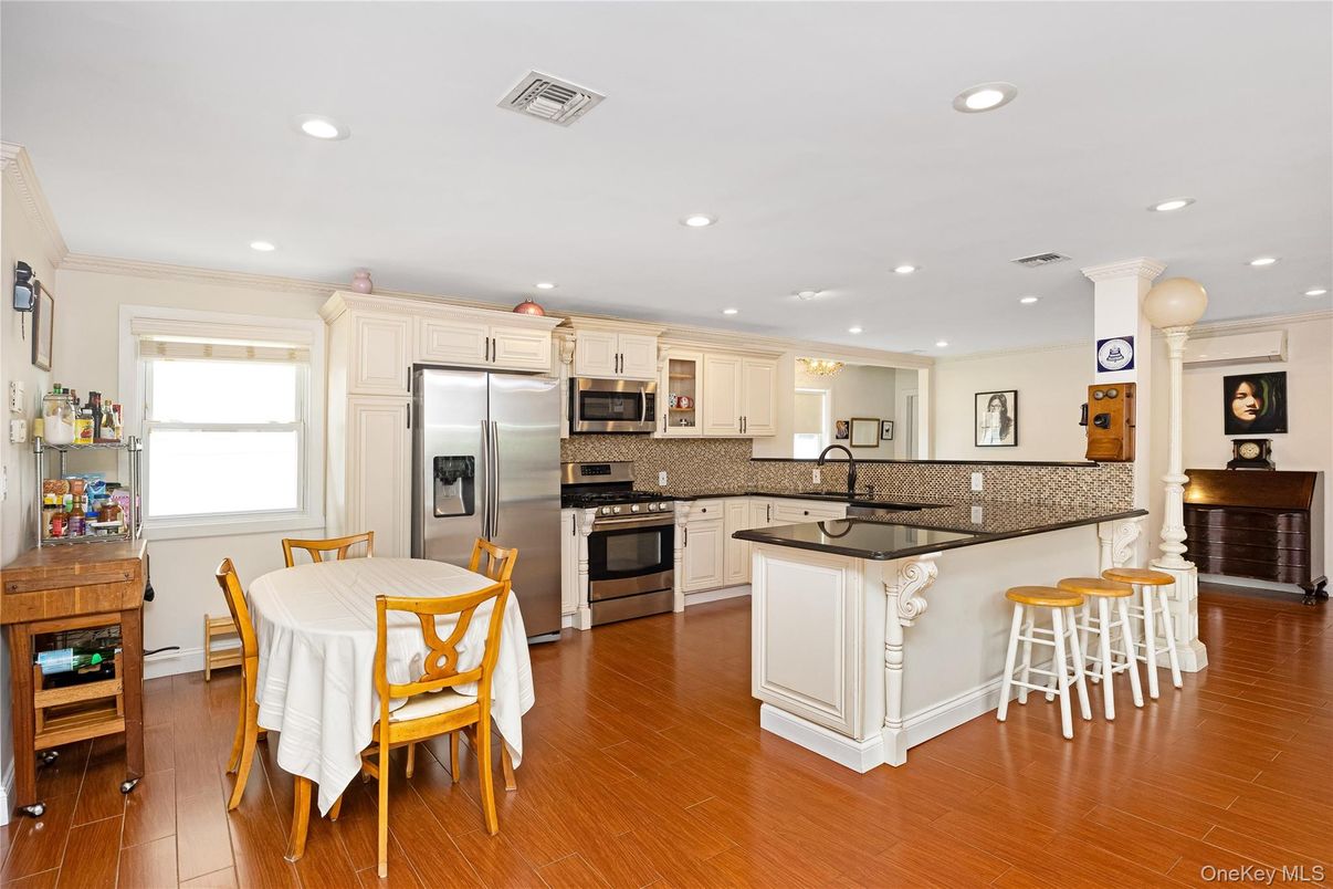 Dining room, Interior, Kitchen, Recessed Lighting, Stainless Steel Appliances, Wood Texture Flooring