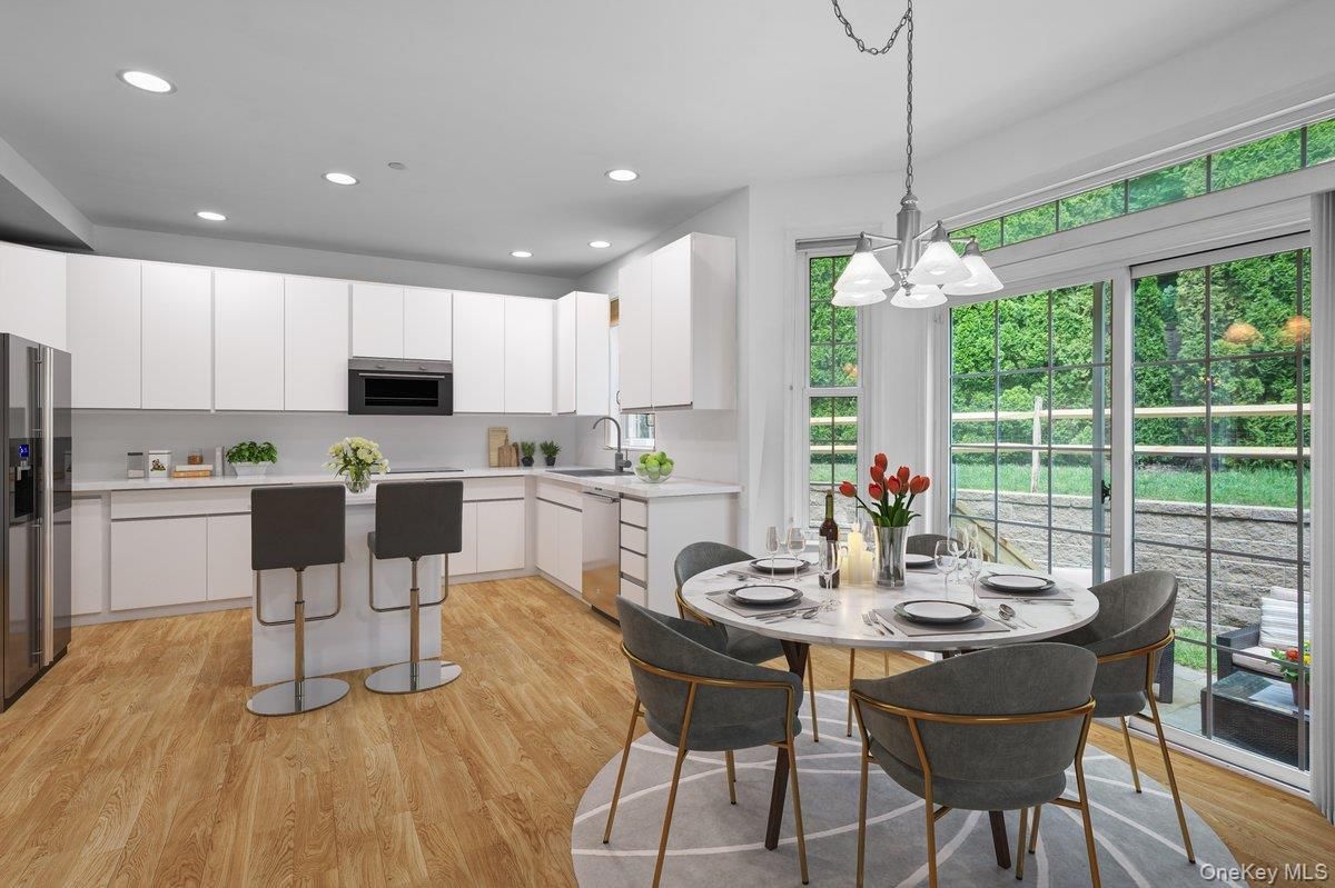 Chandelier, Dining room, Interior, Kitchen, Pendant Lights, Recessed Lighting, Stainless Steel Appliances, Wood Texture Flooring