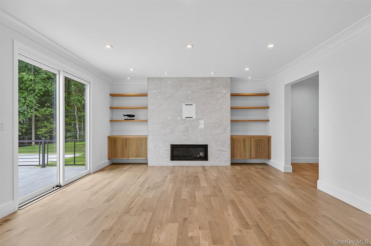 Fireplace, Interior, Marble Walls, Recessed Lighting, Wood Texture Flooring