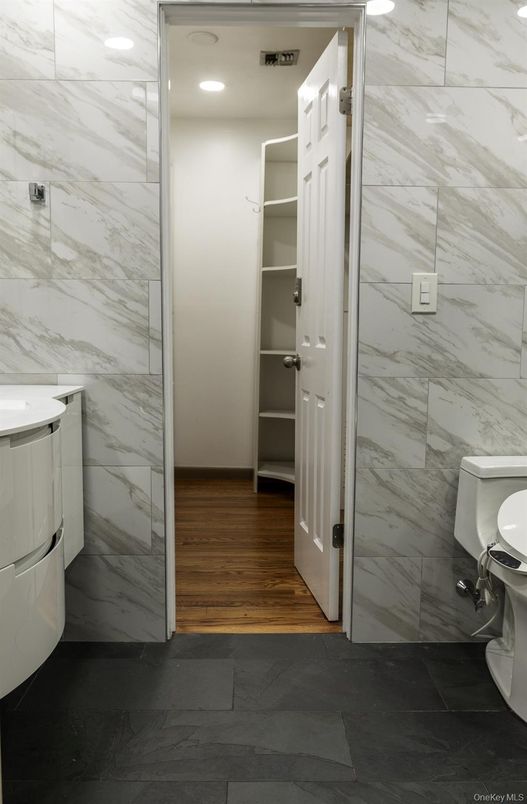 Bathroom, Interior, Marble Walls, Recessed Lighting, Wood Texture Flooring