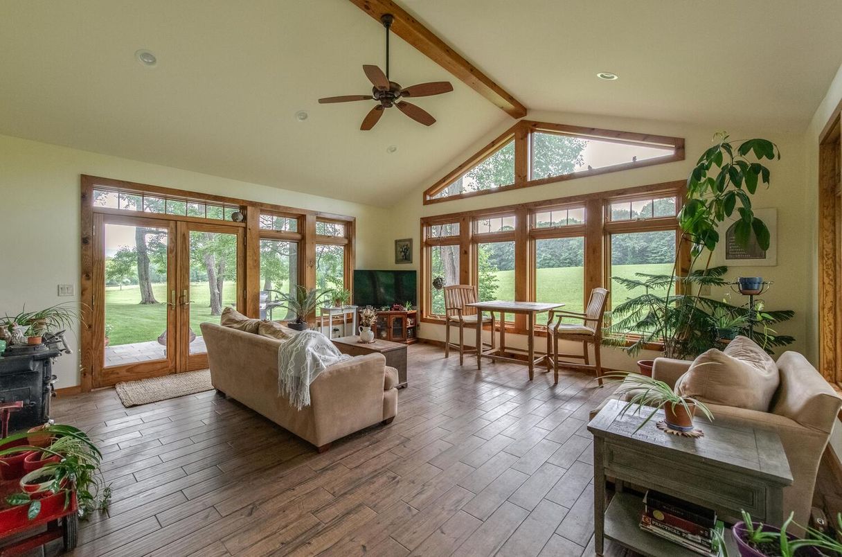 Dining room, Fireplace, Interior, Living room, Recessed Lighting, Wood Texture Flooring