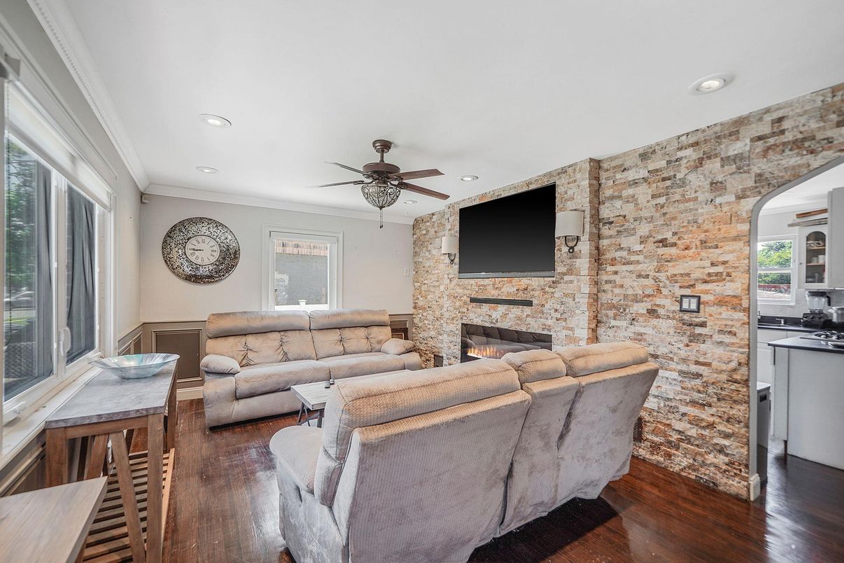 Fireplace, Interior, Living room, Recessed Lighting, Stone Walls, Wood Texture Flooring