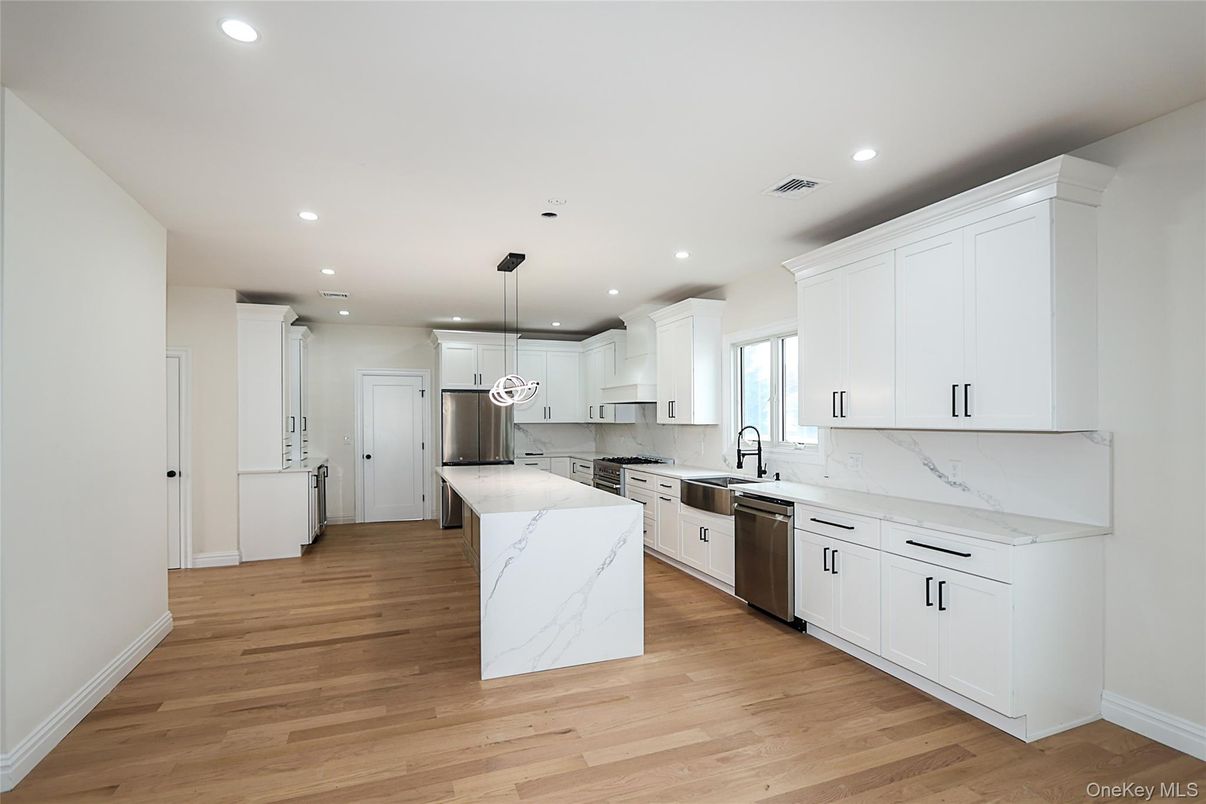 Interior, Kitchen, Marble Walls, Pendant Lights, Recessed Lighting, Stainless Steel Appliances, Wood Texture Flooring