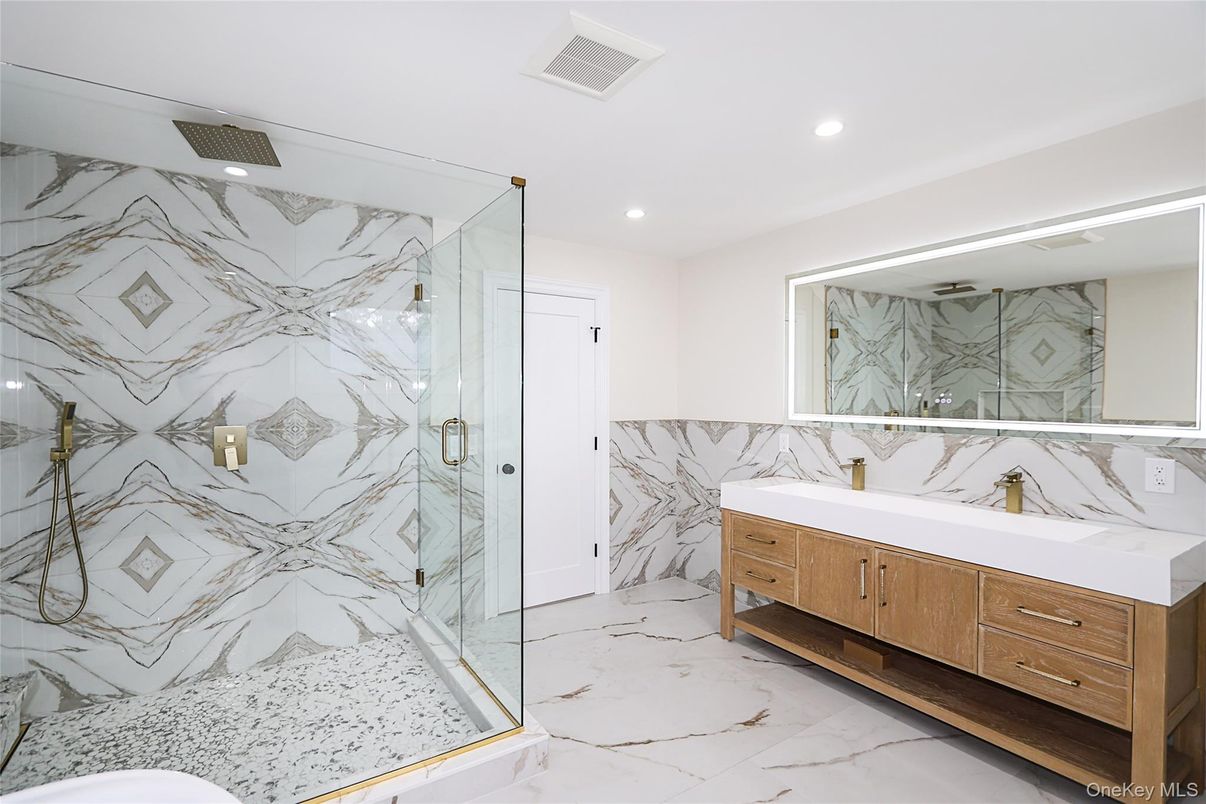 Bathroom, Dual Sink Vanities, Glass Shower, Interior, Marble, Marble Walls, Recessed Lighting