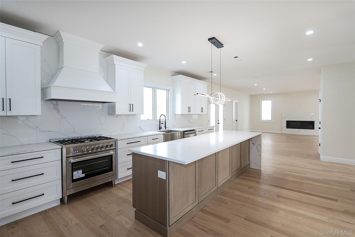 Interior, Kitchen, Marble Walls, Pendant Lights, Recessed Lighting, Stainless Steel Appliances, Wood Texture Flooring