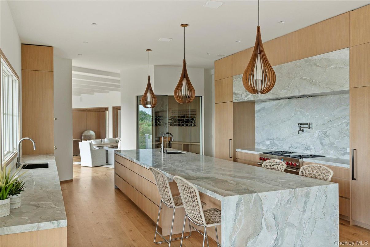 Interior, Kitchen, Marble Walls, Pendant Lights, Recessed Lighting, Stainless Steel Appliances, Wood Texture Flooring