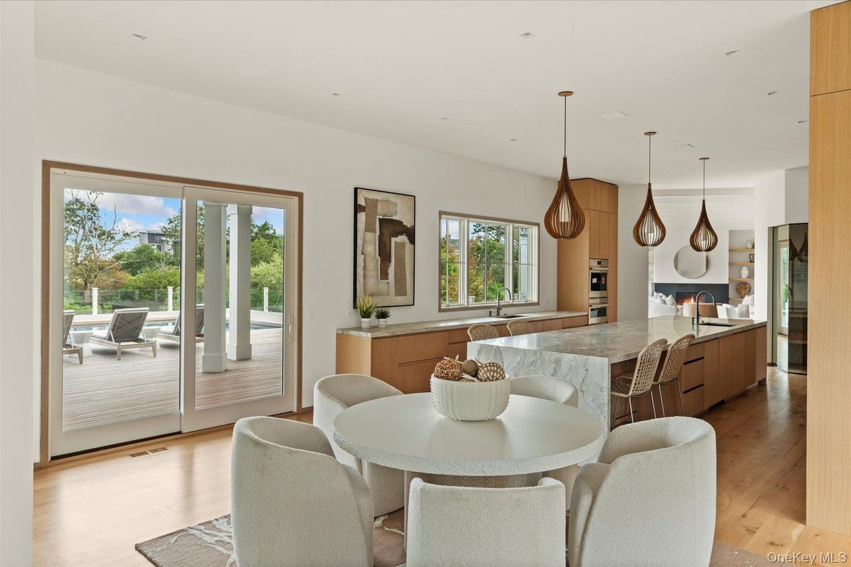 Dining room, Interior, Kitchen, Pendant Lights, Recessed Lighting, Stainless Steel Appliances, Wood Texture Flooring