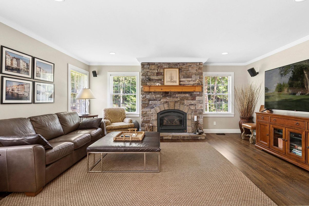 Fireplace, Interior, Living room, Recessed Lighting, Stone Walls, Wood Texture Flooring