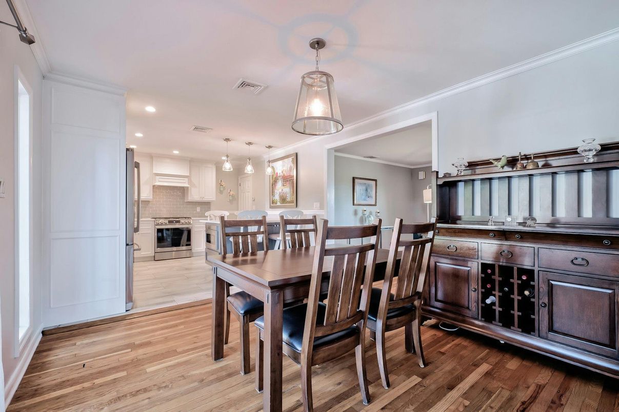 Dining room, Interior, Kitchen, Pendant Lights, Recessed Lighting, Stainless Steel Appliances, Wood Texture Flooring