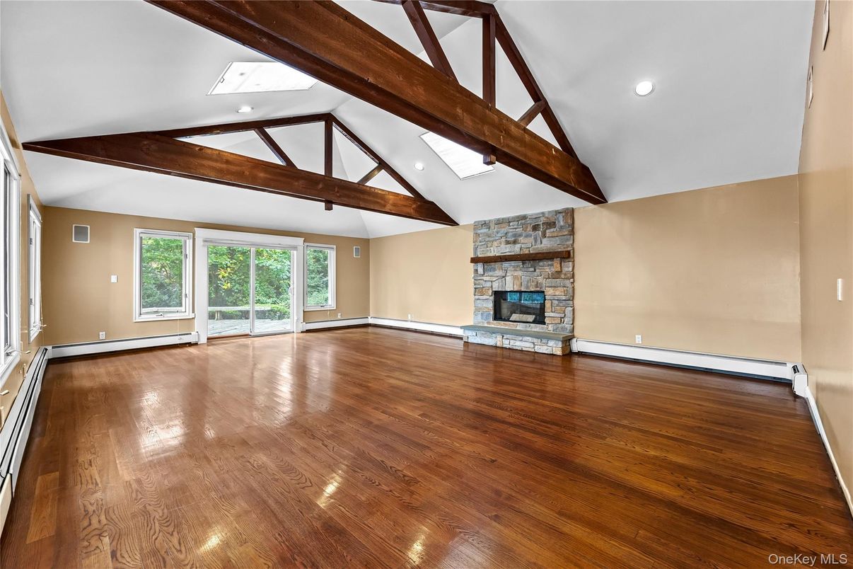 Empty room, Fireplace, Interior, Recessed Lighting, Wooden Beams, Wood Texture Flooring