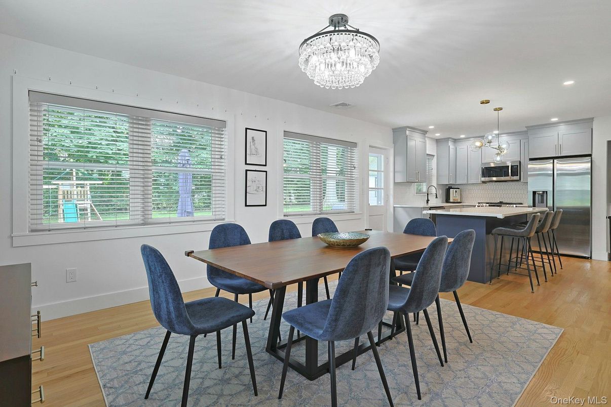 Chandelier, Dining room, Interior, Kitchen, Pendant Lights, Recessed Lighting, Stainless Steel Appliances, Wood Texture Flooring