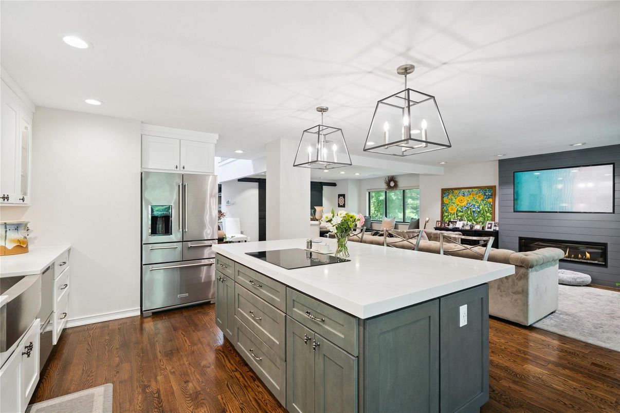 Dining room, Fireplace, Interior, Kitchen, Living room, Pendant Lights, Recessed Lighting, Stainless Steel Appliances, Wood Texture Flooring