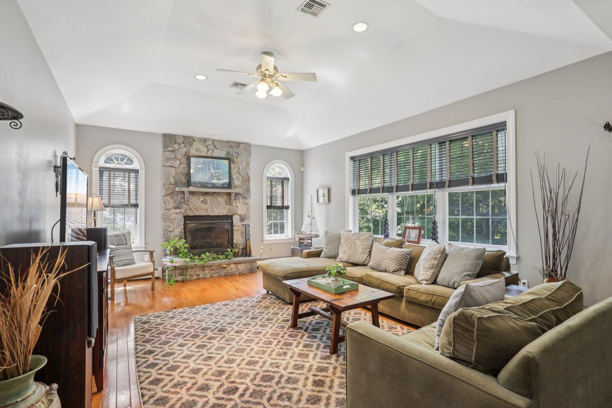 Fireplace, Interior, Living room, Recessed Lighting, Stone Walls, Wood Texture Flooring