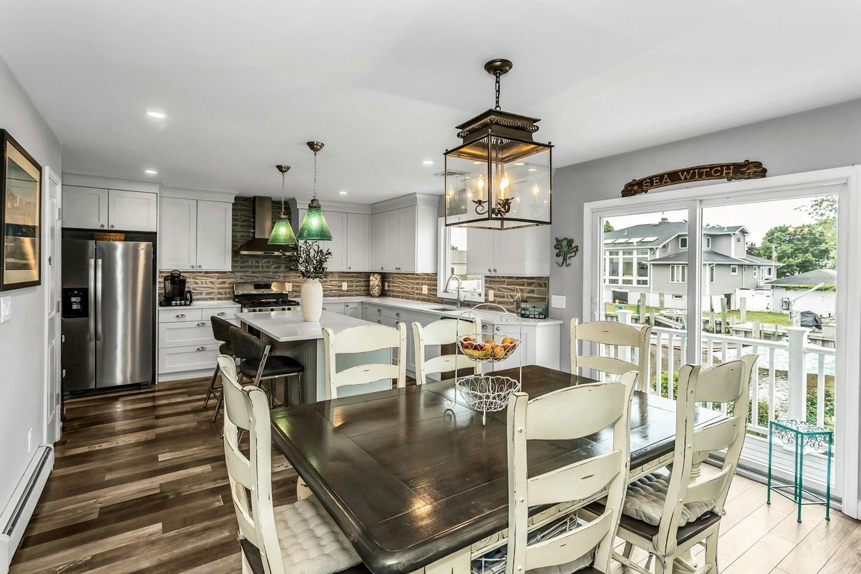 Dining room, Interior, Kitchen, Pendant Lights, Recessed Lighting, Stainless Steel Appliances, Wood Texture Flooring