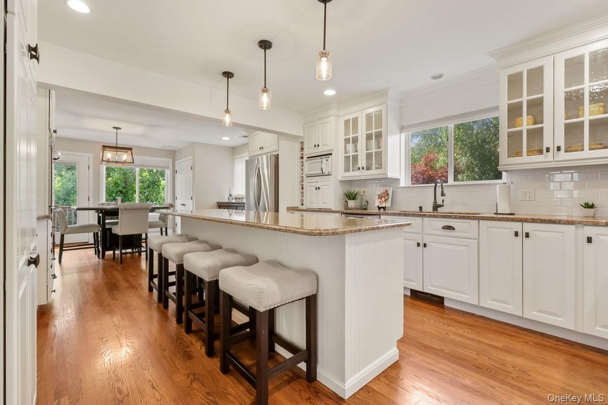 Dining room, Interior, Kitchen, Pendant Lights, Recessed Lighting, Stainless Steel Appliances, Wood Texture Flooring