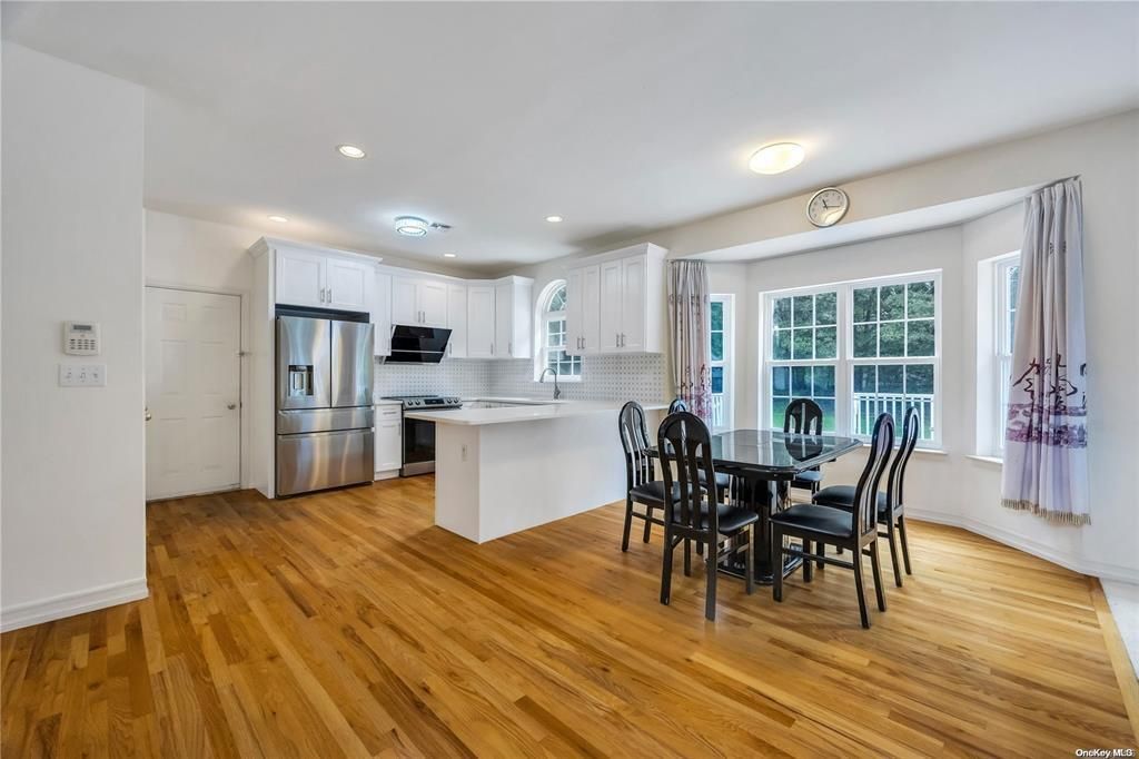 Dining room, Interior, Kitchen, Recessed Lighting, Stainless Steel Appliances, Wood Texture Flooring