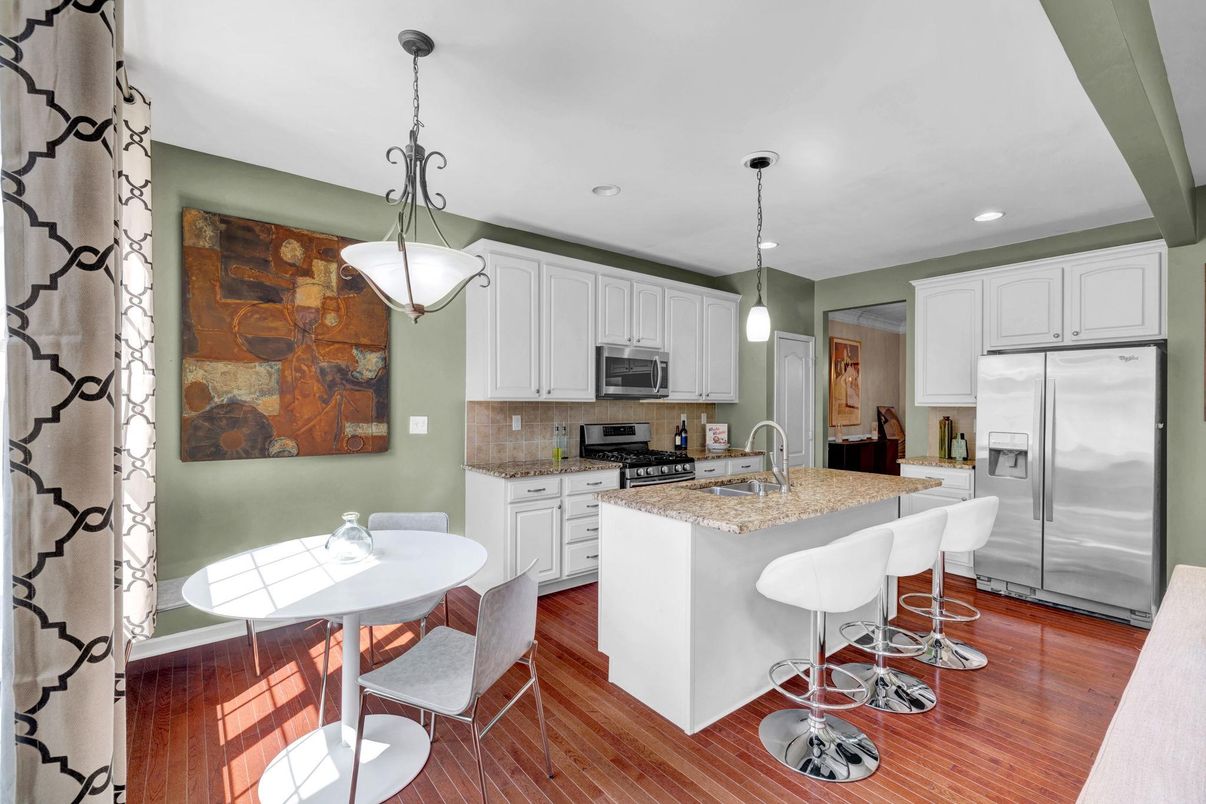 Dining room, Interior, Kitchen, Pendant Lights, Recessed Lighting, Stainless Steel Appliances, Wood Texture Flooring