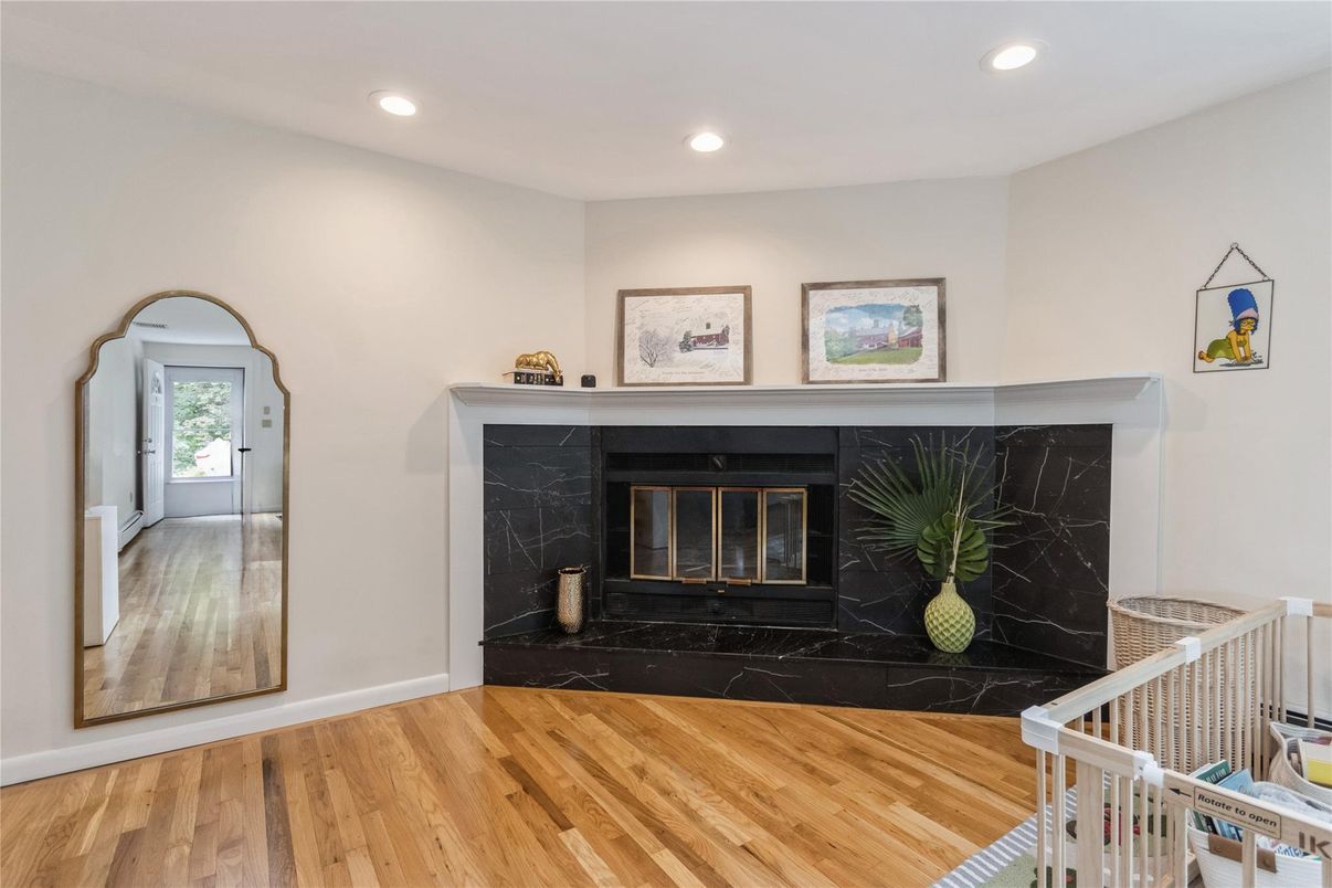 Fireplace, Interior, Marble Walls, Recessed Lighting, Wood Texture Flooring