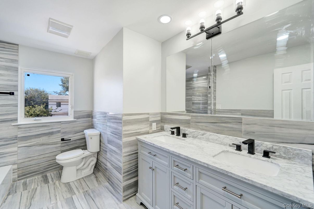 Bathroom, Dual Sink Vanities, Interior, Recessed Lighting, Wood Texture Flooring