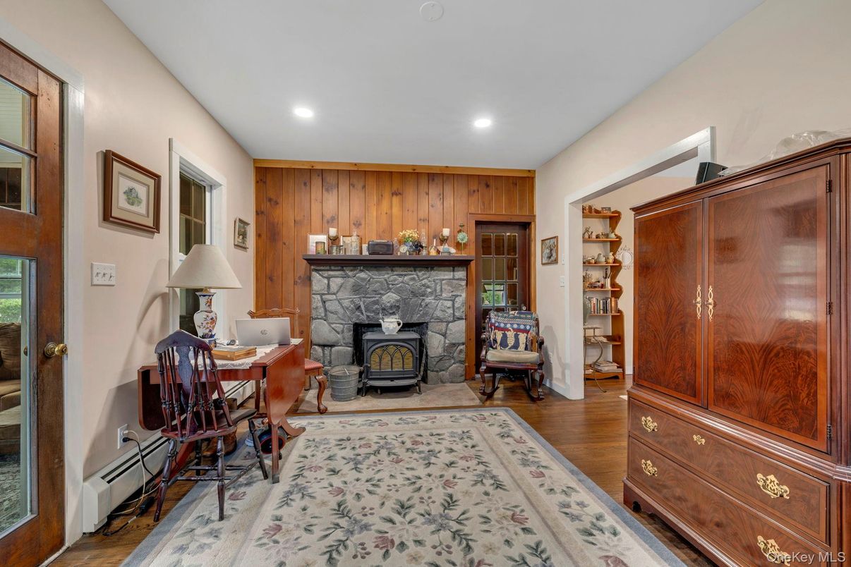 Fireplace, Home Office, Interior, Recessed Lighting, Wood Texture Flooring, Wooden Walls